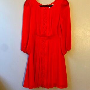 Jessica Simpson dress size 6 orange in color made of 100% polyester.